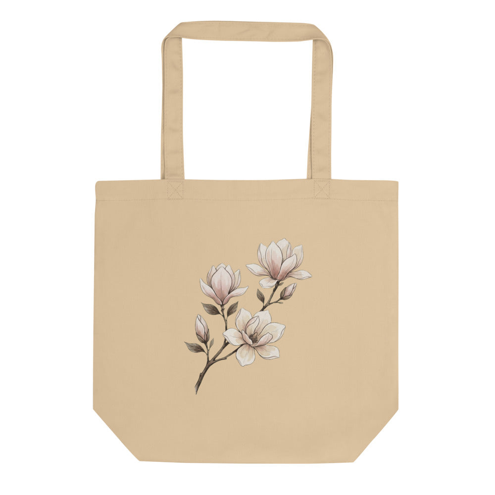 Tote bag botanique minimaliste femme, face avant : illustration branche de magnolia en encre fine et lavis aquarelle rose poudré, impression DTG sur toile de coton 38×42 cm